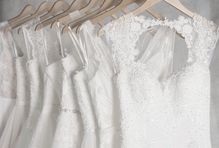 Bridal gowns hanging on a rail