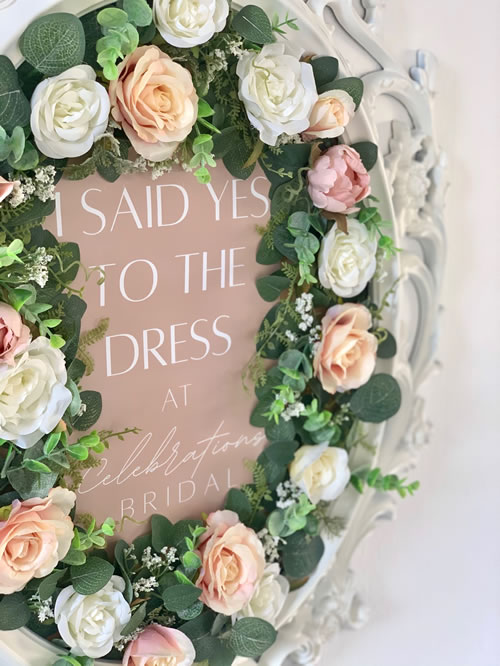 Bridal sign with I said yes to the dress surrounded by flowers